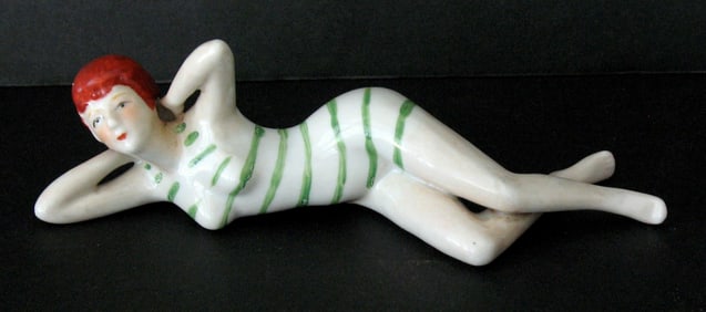 Antique porcelain bathing beauty figurine.