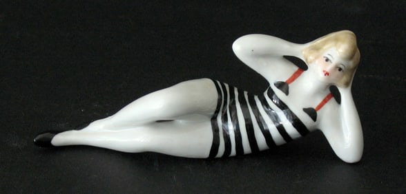 Antique porcelain bathing beauty figurine.
