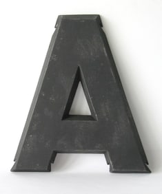 Vintage cast metal letter “A”.
