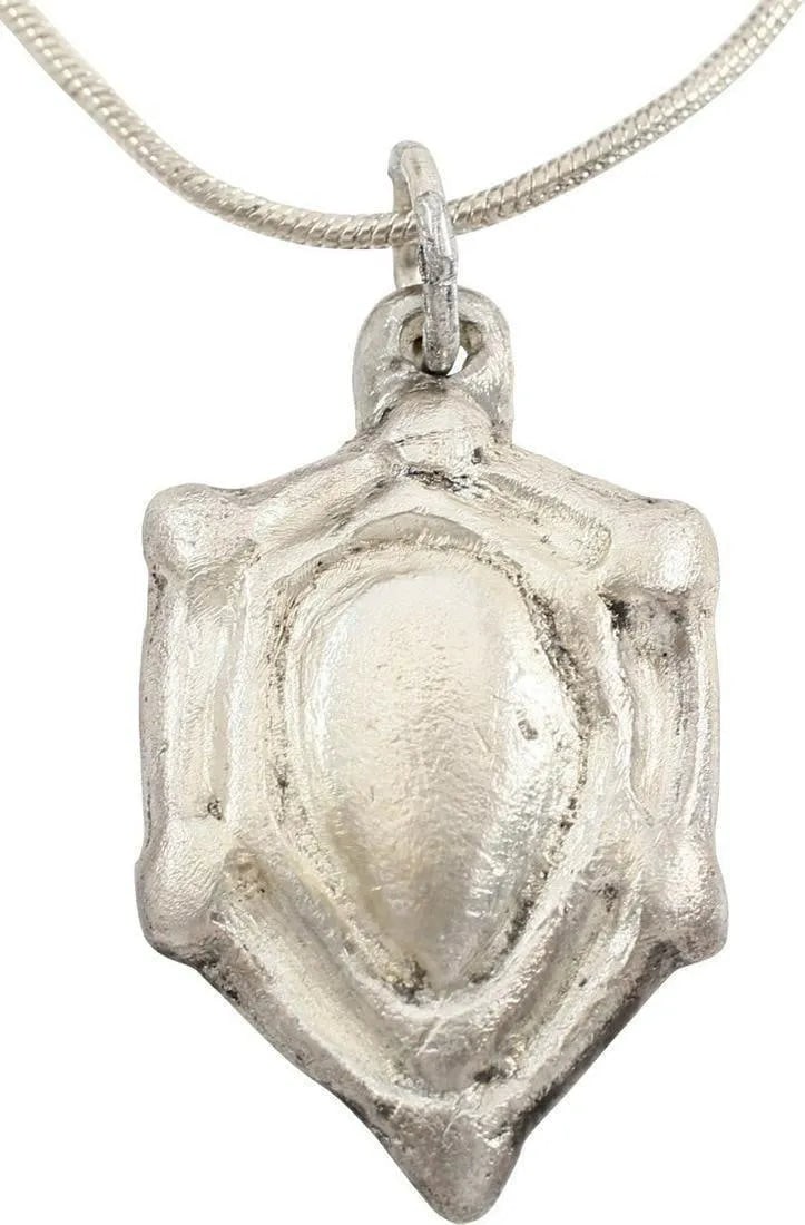 SCANDINAVIAN HEART PENDANT NECKLACE, 11TH-12TH C. AD: The period of conversion to Christianity for Vikings. A remnant of the old pagan mythology in the form of an anatomically accurate heart, with raised border and nubs at the sixth points. A curious thr