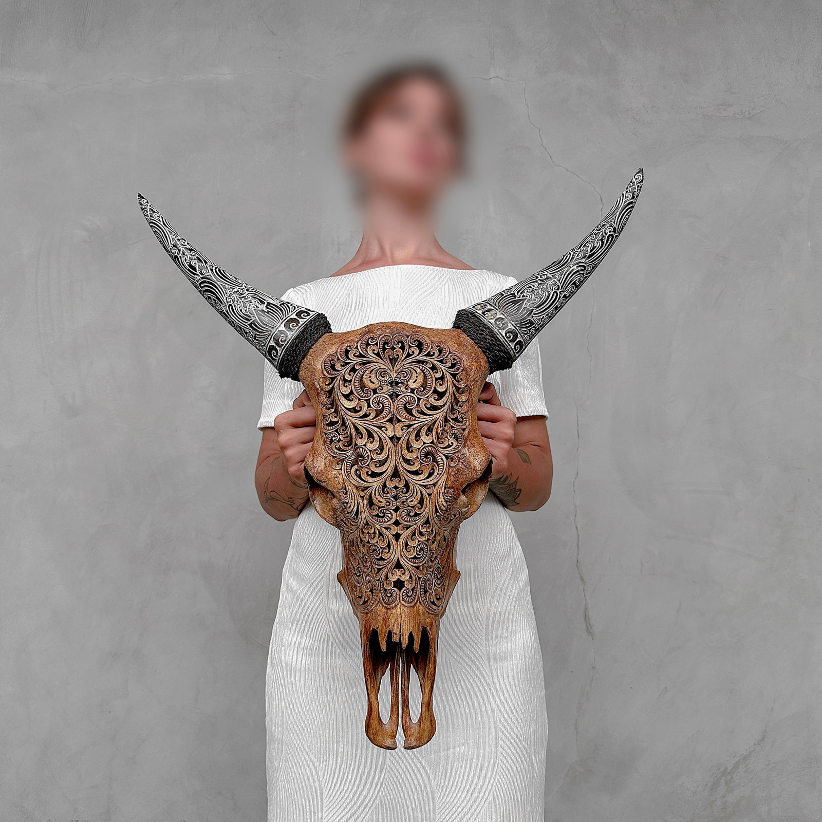 Brown cow skull with carved horns - Traditional Balinese motif: Title: Brown cow skull with carved horns - Traditional Balinese motif Maker:Unknown Origin: Indonesia Date/Period:2025 Materials:Bos Taurus, horn Dimensions:Height: 63 cm / 24.8 inches. Length: 59 cm 