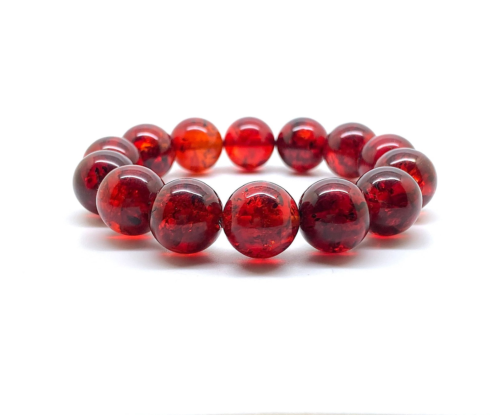 Fascinating Amber Bracelet made from Round Amber beads: Title: Fascinating Amber Bracelet made from Round Amber beads Metal: Sterling Silver Gemstone: Amber Size: Bead size: 14.0 mm Bead size: 0.551 inches Weight: 74 Made of: (Reconstituted Amber or Whole 