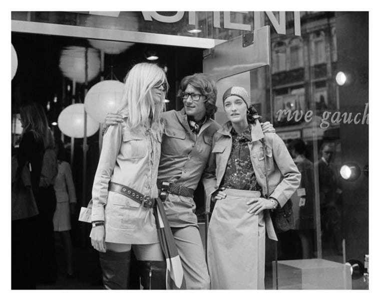 Yves Saint Laurent 16x16" Silver Gelatin Fibre Print: Description Yves Saint Laurent 16x16" Silver Gelatin Fibre Print Yves Saint Laurent, French designer with two fashion models, Betty Catroux (left) and Loulou de la Falaise, outside his ‘Rive Gau
