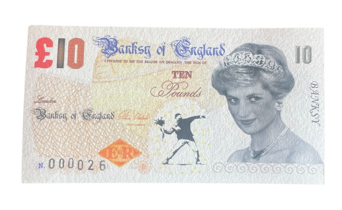 Banksy Di-Faced Tenner: Description: Banksy Di-Faced Tenner measuring at 3x5 inches Date: 2004 Material: Fine Art Paper Reserve: $50.00 Shipping: Domestic: Flat-rate of $15.00 to anywhere within the contiguous U.S. Internati