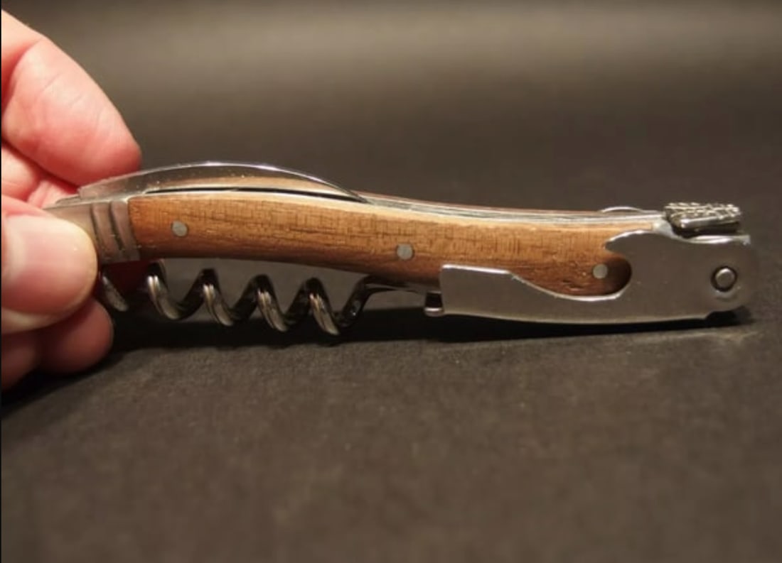 Laguiole Corkscrew with Walnut Wood Handles: 4 1/2" long x 5/8" WideNice quality, brand new, never used heavy waiters style Laguiole corkscrew with walnut wood handles.This piece is made from stainless steel with a ribbed corkscrew worm and extr
