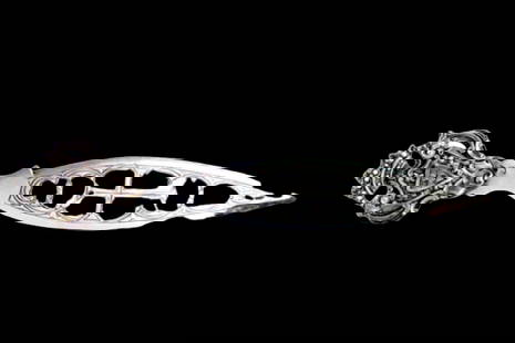 Letter opener in cut silver and engraved with coat of arms: Description: Letter opener in cut-out silver and engraved with an armorial coat of arms. Metal: Silver. Origin: Portuguese. Brand: Javali II Title. Weight: 36.34 grams | 1.28 ounces. Dimensions: 20x3.