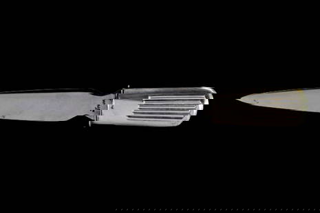 Silver letter opener with fluted relief on the handle: Description: Silver letter opener with fluted relief on the handle. Metal: Silver. Origin: Portuguese. Brand: Cabeça de eagle. Weight: 42.44 grams | 1.5 ounces. Dimensions: 19.5x23.7 cm | 7.68x9.33 i