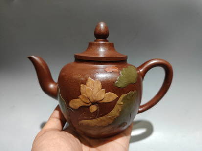Chinese Yixing Zisha Clay Lotus Flower Teapot: Title: Chinese Yixing Zisha Clay Lotus Flower Teapot Date/Period: After2000Origin: ChineseDimension: 180x130(mm) 7.09x5.12(inches) Materials: Yixing Zisha Reserve: $356.00 Shipping:Domestic: