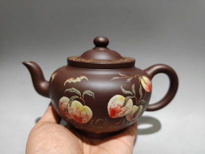 Chinese Yixing Zisha Clay Peach Teapot w Artist Signed: Title: Chinese Yixing Zisha Clay Peach Teapot w Artist SignedDate/Period: After2000Origin: ChineseDimension: 180x110x(mm) 7.09x4.33(inches) Materials: Yixing Zisha Reserve: $356.00 
