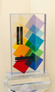 Lucite Acrylic sculpture Topazio by Grace Absi: A sculpture of a Lucite block handcrafted in the interiors with a geometric motif, laminated together on a clear, thick base, and hand-signed by the artist Grace Absi. It is in fine condition and incl