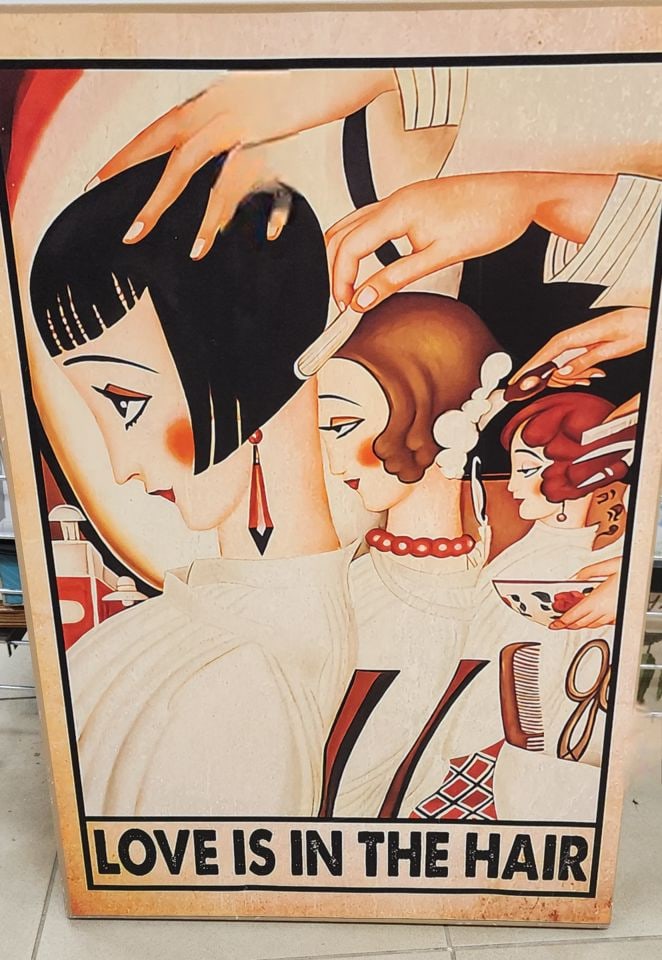 By Gerda Wegener. Rare large vintage canvas print of the deco sign entitled "Love Is In The Hair".: The image is a vintage canvas print of an oil painting reproduction of the iconic deco metal sign titled "Love Is In The Hair," featuring artwork by Danish artist Gerda Wegener, known for her Art Deco