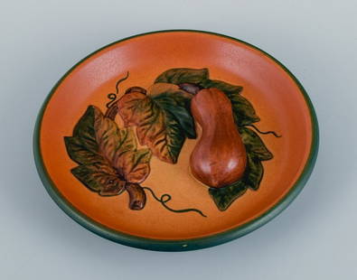 Ipsen's, Denmark. Bowl with leaves and pumpkins, glaze in shades of orange-green.: Ipsen's, Denmark. Bowl with leaves and pumpkins, glaze in shades of orange-green. Model 8. 1920s/30s. In excellent condition. Marked Dimensions: D 17.0 x H 3.0 cm. Reserve: $196.00 Shipping: Domestic: