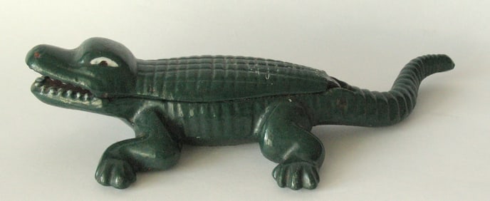 Antique cast iron alligator nut cracker in original paint.