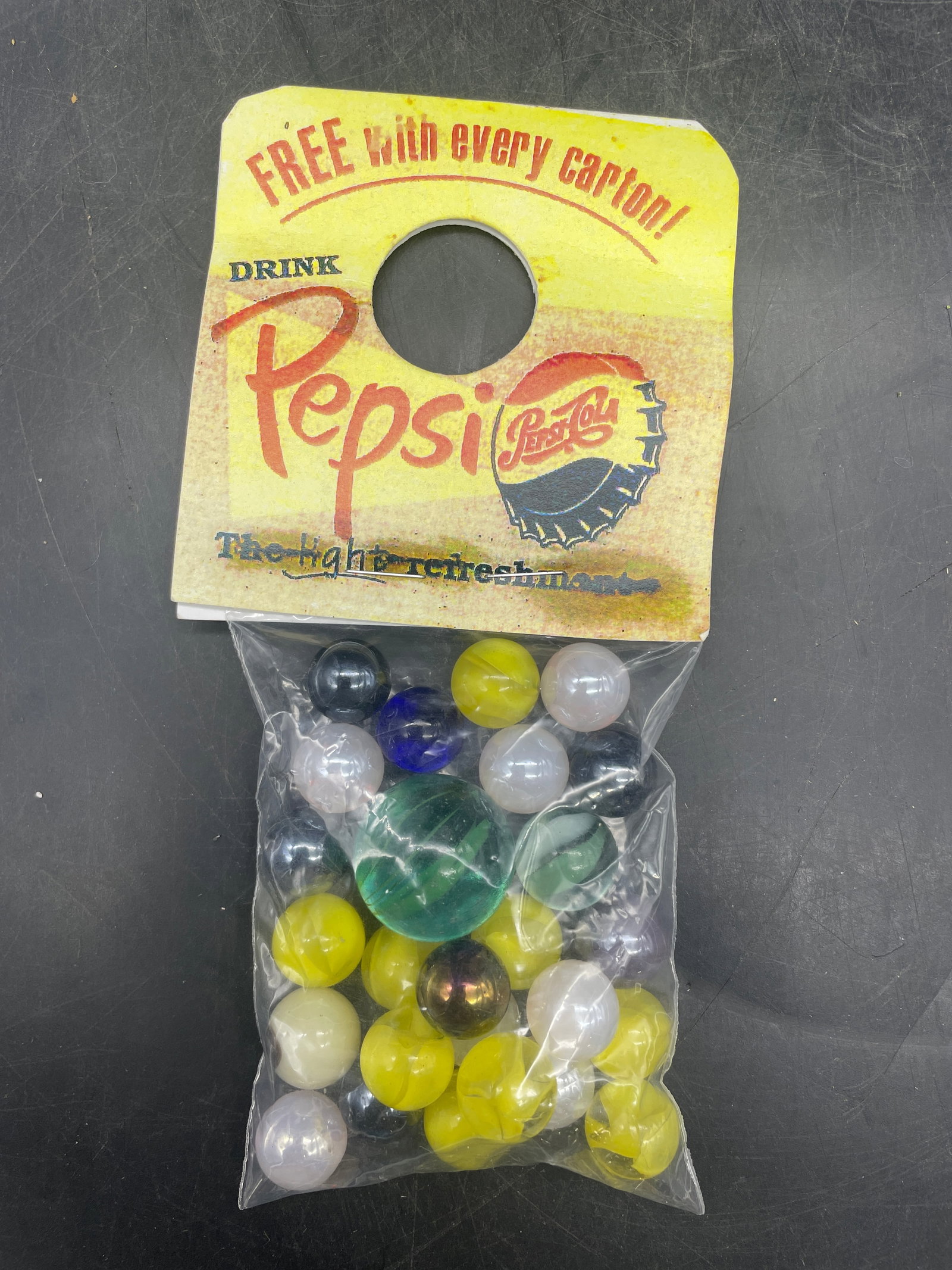 Pepsi Promotional Marbles include Uranium Glass: Title: Pepsi Promotional Marbles include Uranium Glass Date/Period: UNKNOWN Dimension: various Material: unknown Additional Information: Pepsi Promotional Marbles include a Uranium Glass marble Shippi