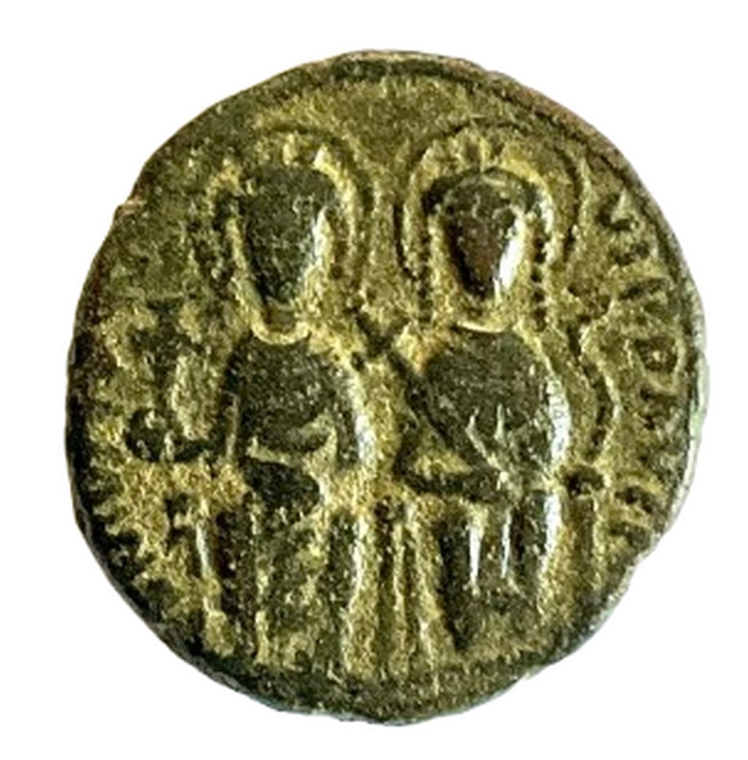Byzantine Empire, Justin II & Sophia, 570/71 C.E., Bronze Follis, Large M Reverse: Title: Byzantine Empire, Justin II & Sophia, 570/71 C.E., Bronze Follis, Large M Reverse Date/Period: 570/71 C.E. Materials: Bronze Size: 26.5mm Description: Struck in Constantinople in 570/71 C.E., t