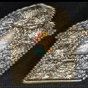 Early 20th C Tibetan Silver Gau Shrine Box: Title:Early 20th C Tibetan Silver Gau Shrine Box Size:3 5/8in (9.2 cm) tall x 3 1/4in (8.3 cm) wide x 1 3/8in (3.4 cm) deep. Description:An early 20th C finely crafted gau box with a repousse front pa