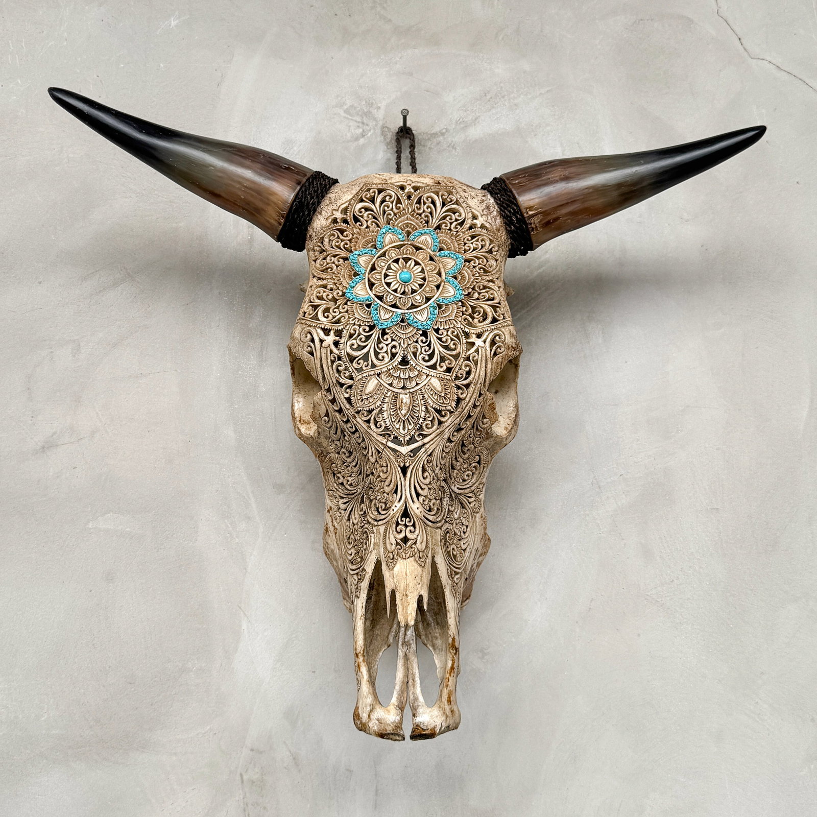 Brown bull's skull - Flower mandala motif with turquoise inlay: Title: Brown bull's skull - Flower mandala motif with turquoise inlay Maker:Unknown Origin: Indonesia Date/Period:2025 Materials:Bos Taurus, bone, horn Dimensions:Height: 53 cm / 20.8 inches. Length: 