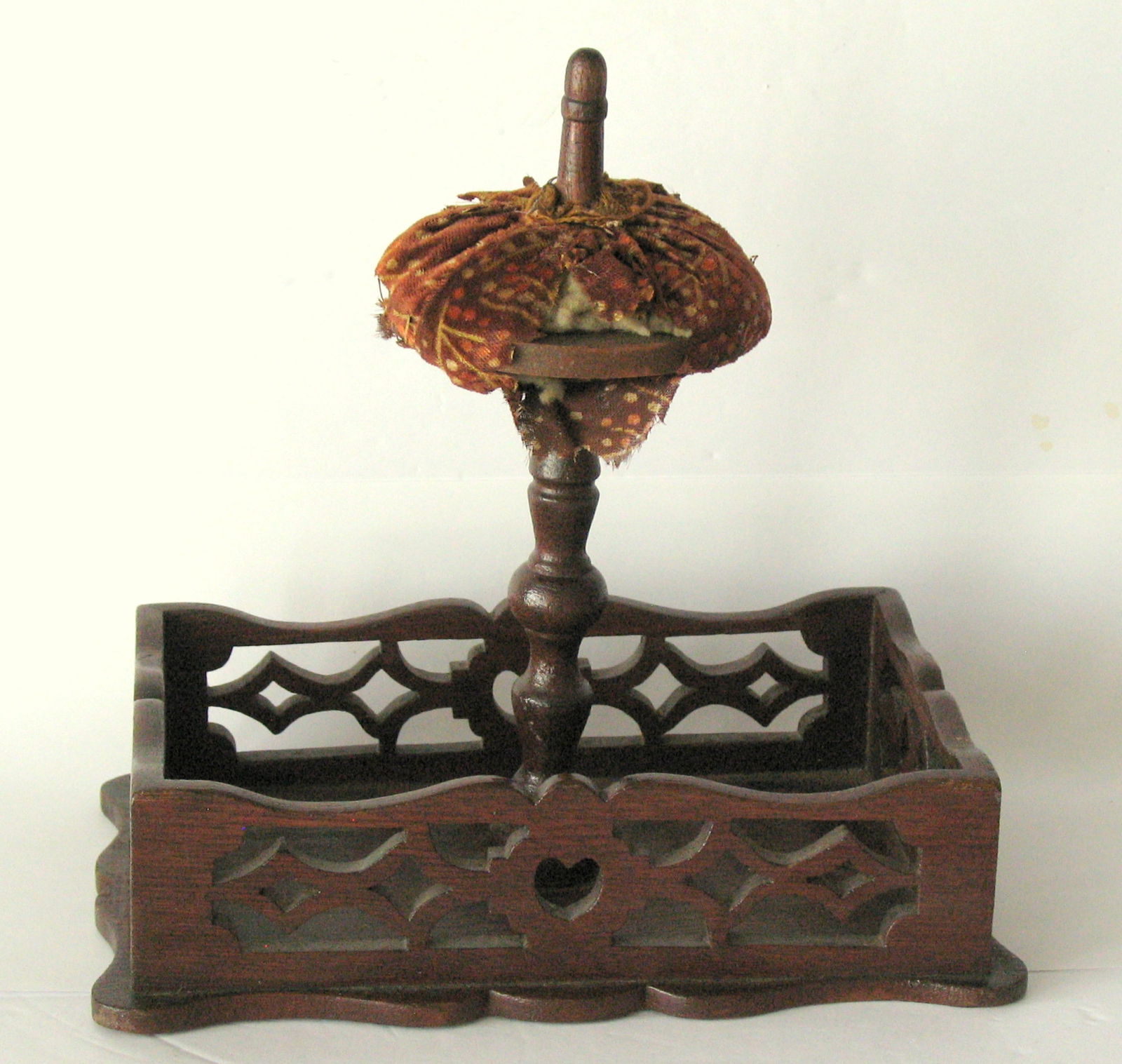 Antique Victorian sewing caddie with pin cushion top.: Title: Antique Victorian sewing caddie with pin cushion top. Date/Period: 1800's Dimension: 9” x 6” x 9” high Additional Information: Nice antique Victorian sewing caddie with pin cu