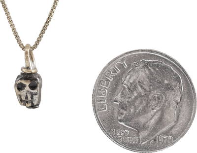 MEDIEVAL TIBETAN SKULL PRAYER BEAD: This small bronze bead, hand crafted about 1400-1550 was part of a Buddhist prayer ritual. It was strung along with others, each showing differences from hand work, to aid the devotee by focusing conc