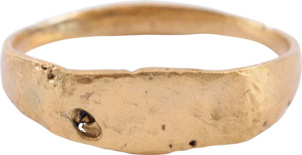 ROMAN RING C.4TH-6TH CENTURY AD, SIZE 8 1/4: Good wearable size 8 1/4. Gilt bronze with 1.2mm rounded face band flaring to the shoulders. Lenticular bezel with an indecipherable design, worn from use. Probably a signet ring. Surface heavily text
