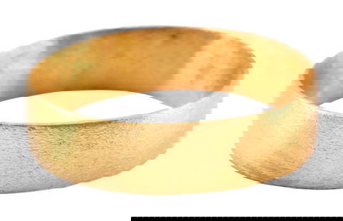 VIKING WEDDING RING C.850-1050 AD, SIZE 7 1/2: C.850-1050 AD. Gilt bronze, size 7 1/2. 4.9mm width with low rounded face. Surface textured from burial. Professionally refurbished with the 24karat gold surface restored. Jewelry gift boxed with cert