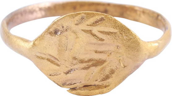 ROMAN SIGNET RING C.3RD-5TH CENTURY AD. 9 1/2: Gilt bronze, size 9 1/2 with 2.1mm deeply rounded faced band and large lozenge shaped bezel cut with mystical symbols, probably with spiritual significance. A man’s ring, worn as a signet which