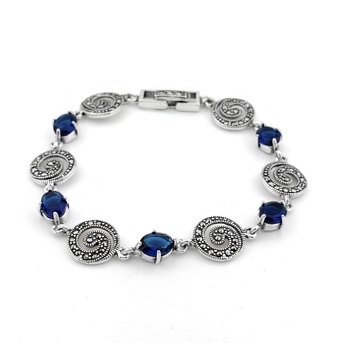 925 Sterling Silver Ladies Bracelet ornated with Blue Zircons and Marcasite: Title: 925 Sterling Silver Ladies Bracelet ornated with Blue Zircons and Marcasite Description: 925 Sterling Silver Ladies Bracelet ornated with Blue Zircons and Marcasite -Condition:New Weight:13.3g