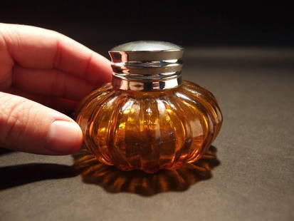 Round Amber Glass Inkwell Ink pot Bottle: Charming 2 1/4" High x 3 1/4" wide Charming Reproduction antique amber glass inkwell. Very heavy thick glass each with charming subtle signs of being hand made. The hinged shiny lid is silver plated b