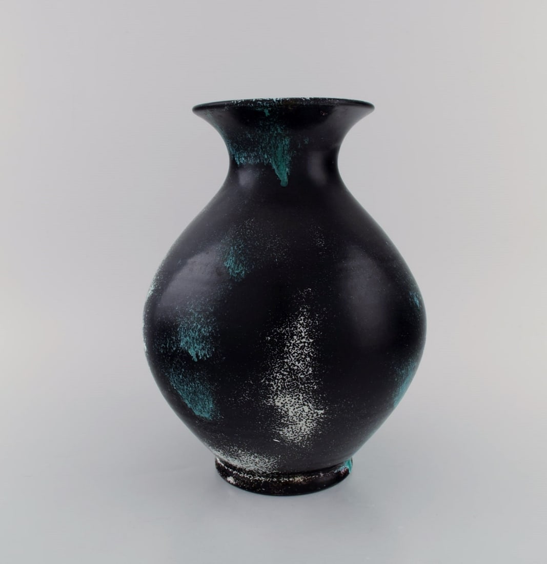 Jens Thirslund for Kähler, HAK. Vase in glazed stoneware. Beautiful glaze in shades of black,: Jens Thirslund for Kähler, HAK. Vase in glazed stoneware. Beautiful glaze in shades of black, white and turquoise. 1920s / 30s. Measures: 26 x 20 cm. In excellent condition. Signed. Reserve: $875