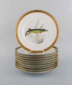 10 Royal Copenhagen porcelain fish plates with hand-painted fish motifs and gold decoration. Fauna