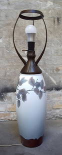 Harald Bing (1848 - 1924) for Bing & Grondahl unique art nouveau table lamp in porcelain.: Harald Bing (1848 - 1924) for Bing & Grondahl unique art nouveau table lamp in porcelain decorated with coloured beech branches, fitting with foliage of brown patinated metal. Signed at the bottom in