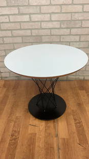 Mid Century Modern Isamu Noguchi White Cyclone Side Table: Vintage from the 1970s Read the full description Materials: wood, metal, birch plywood, while laminate, cast iron, steel Vintage Mid Century Modern Isamu Noguchi Cyclone Side Table This mid century mo
