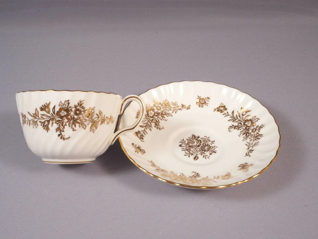 Minton MARLOW GOLD ROSE Flowers Coffee Tea CUP Saucer Set H5017 England: This is one set of Tea/Coffee cup and Saucer, from the famous Marlow Gold collection by Minton - Made in England. The pattern is with swirling shape, gold edge and gold flowers at the rim and in the c
