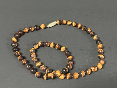 Tiger Eye Stone Necklace: Title: Tiger Eye Stone Necklace Date/Period: Late 20th Century Dimension: 16" round Material: Tiger Eye Stone Additional Information: Tiger Eye Stone Necklace Reserve: $30.00 Shipping: Domestic: Flat-