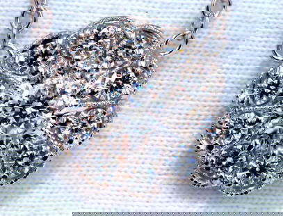 .94ct natural diamonds halo cluster necklace 14kt Edwardian Deco: Halo diamond cluster .94ct. Total Natural diamonds necklace .30ct. Center diamond .64ct Side Diamonds G-color Vs-2 clarity. Full cut round brilliants 14kt. white gold. cluster diameter: 14mm Necklace:
