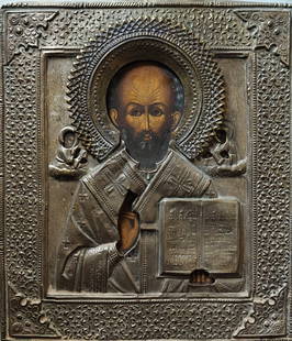 ANTIQUE 19c RUSSIAN HAND PAINTED ICON ST.NICHOLAS WITH OKLAD (1988): ANTIQUE 19c RUSSIAN ICON OF ST.NICOLAS WITH METAL OKLAD ICON IS IN VERY GOOD ANTIQUE CONDITION. HAND PAINTED WITH EGG TEMPERA AND GESSO,GOLD LEAF ON WOOD PANEL. SIZE : H 35,5 x 31,5cm. Reserve: $550.0