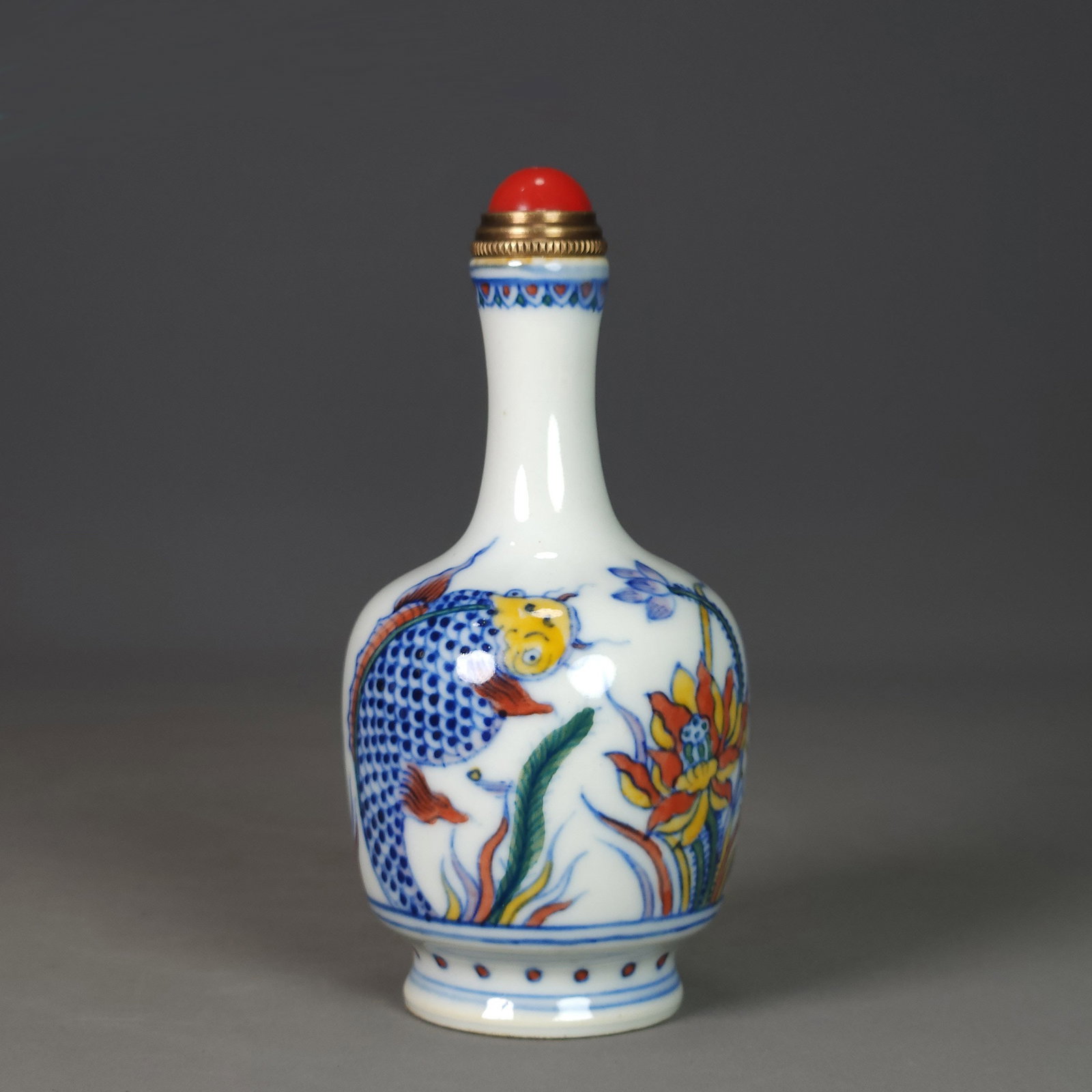 Old Chinese Doucai Fish Porcelain Snuff Bottle: Title: Old Chinese Doucai Fish Porcelain Snuff Bottle Date/Period: After1900 Origin: Chinese Dimension: 90x45(mm) 3.54x1.77(inches) Materials: Porcelain Reserve: $150.00 Shipping: Domestic: Shipping r