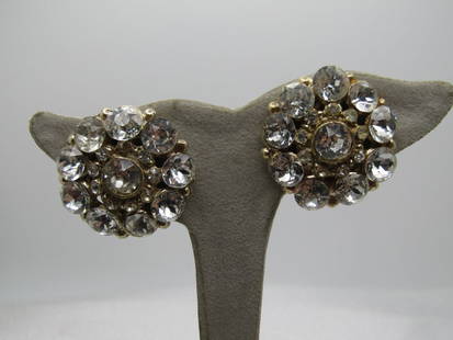 Vintage Clear Rhinestone Clip Earrings, 1950's-1960's: Vintage Clear Rhinestone Clip Earrings, 1950's-1960's. Gold tone with a large round stone set in the middle and the same size (appx. 6.5mm) set on the outer edge with smaller stones around the center