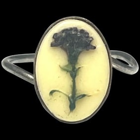Vintage Silver Ring with Raised Flower on Ivory Colored Background