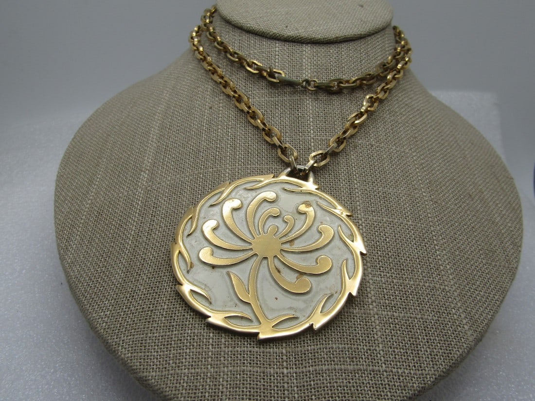 Vintage White Enameled Medallion Necklace, 24", Crown Trifari, 1960's: Vintage White Enameled Medallion Necklace, 24", Crown Trifari, 1960's. White enameled background with a raised gold tone blossom in the center and scrolled ridged edge and gold tone back with a 5mm wi
