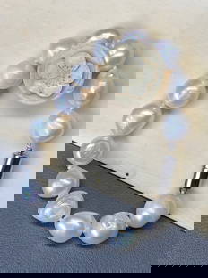 12mm South Sea Large Natural White Iridescent Baroque Pearl Bracelet: Title: 12mm South Sea Large Natural White Iridescent Baroque Pearl Bracelet Description:Indulge in the opulence of the ocean with our Priceless 12mm South Sea Huge Natural White Iridescent 14-Piece Ba