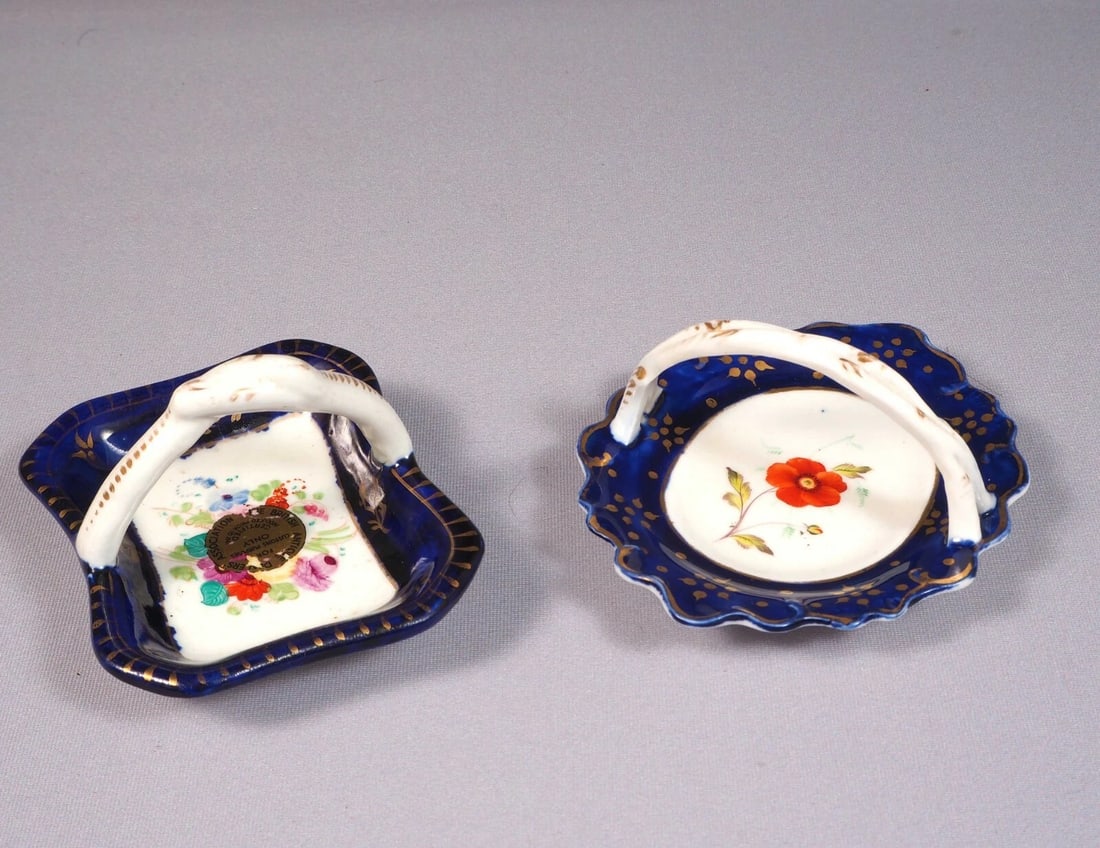 2 Antique Porcelain Cobalt Basket Tray Candy Nut Dish Set Handles Certified 1841: This is an exceptional Set of 2 (two) small Baskets/Nut Dishes/Trays. They are in cobalt blue and gold. One of them bears and British antique Dealers Association certifying that is made prior to 1841.