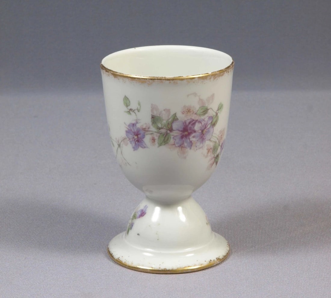 Limoges CH Field Haviland France EGG CUP LARGE Purple Flowers Clematis Vines: This is rare and hard to find LARGE Egg cup. The cup was made in CHField Haviland in Limoges, France. The cup is 2 5/8" in diameter and 4 1/8" deep It will make a wonderful gift or will be a great add