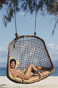 Private Island, Philippines ' By Slim Aarons Oversized C Type: Description ' Private Island, Philippines ' by Slim Aarons A guest relaxing on the beach of a private island owned by Philippine Airlines President, Benigno Toda Jr., Philippines, February 1973. 