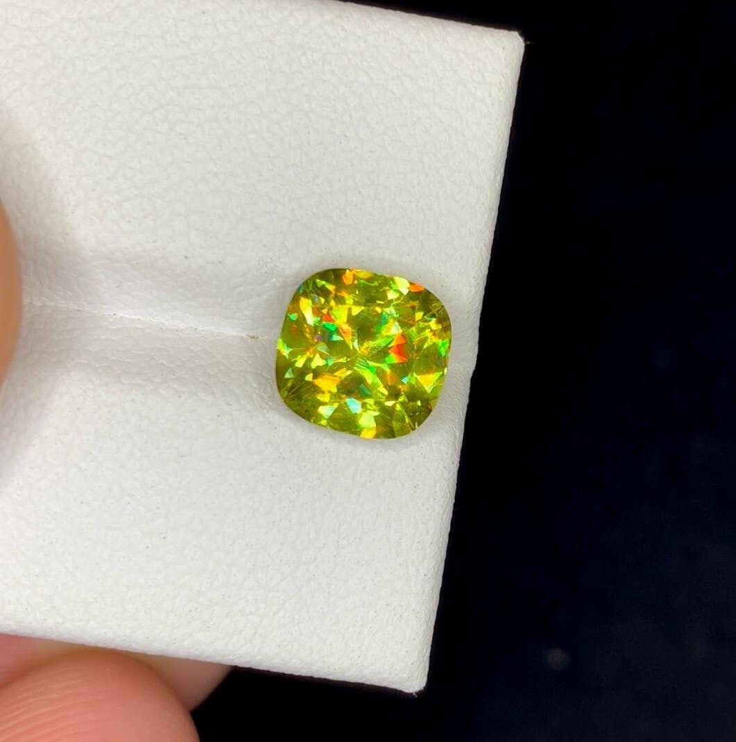 Natural Sphene Titanite Gemstone, Full Fire Lustrous Sphene Fancy Cushion Shape, for Ring, June: Materials: Gem type: Sphene Carat weight: 2.80 Natural Sphene Titanite Gemstone, Full Fire Lustrous Sphene Fancy Cushion Shape, for Ring, June Birthstone Weight : 2.80 cts Dimensions : 8*7.5*5 mm Colo
