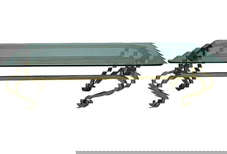 Glamorous Hollywood Regency Gilt Metal Coffee Table: About the Item This Italian coffee table features a rectilinear gilt iron frame supported by dramatically scrolling cabriole legs. This table is an excellent compliment to any Hollywood Regency or sim