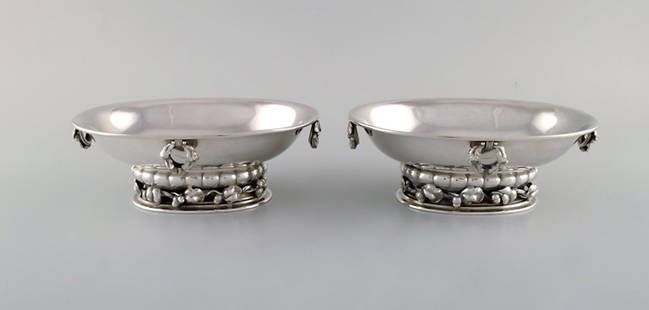 A pair of rare Georg Jensen jardiniere in sterling silver. The bowl is raised on leaves and acorns.: Title:A pair of rare Georg Jensen jardiniere in sterling silver. The bowl is raised on leaves and acorns. Designed by Georg Jensen. Model Number 296D. Dated 1925-32. Description:A pair of rare Georg J