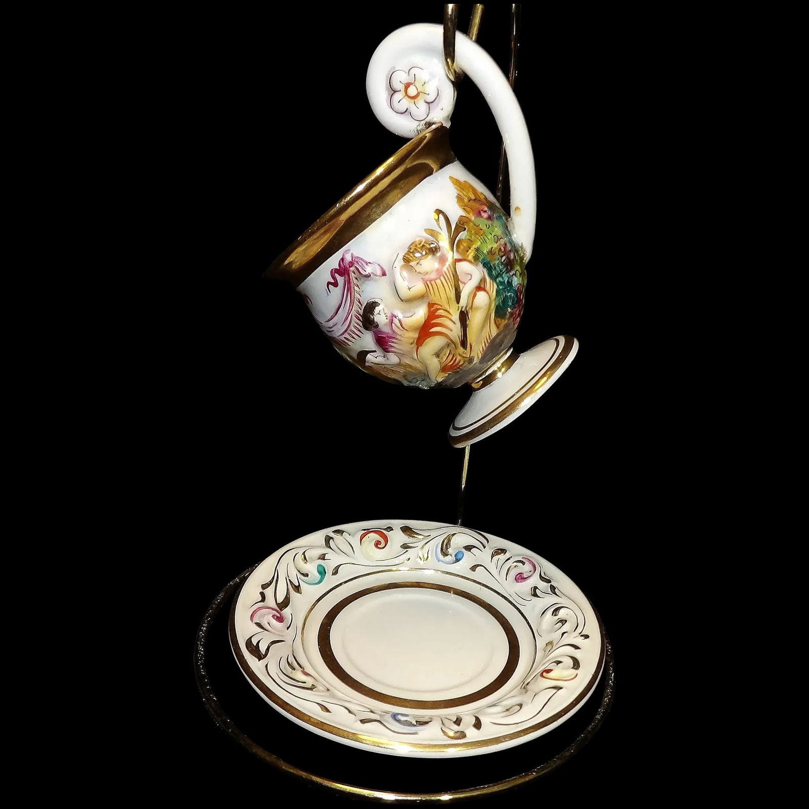 Vintage R Capodimonte GB Demitasse Cup and Saucer: This Vintage R Capodimonte GB Demitasse Cup and Saucer is in near MINT condition. No loss of color, chips, cracks or crazing. Made in Italy. Classic Capodimonte style. Measurements: Cup: With the high