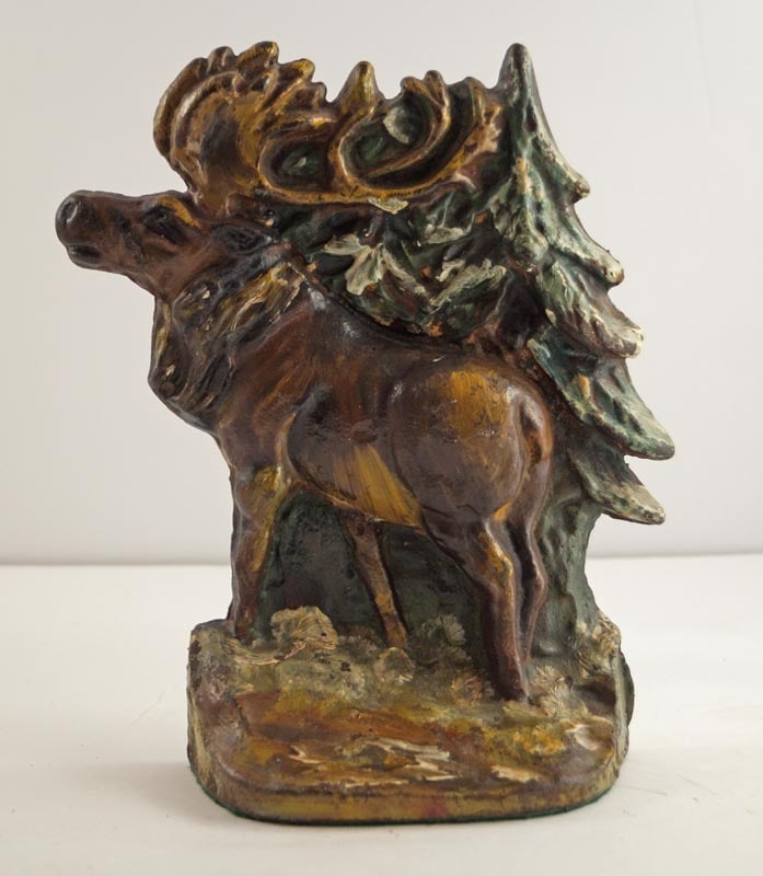 Antique Moose in Forest Cast Iron Doorstop: Title: Antique Moose in Forest Cast Iron Doorstop Dimension: 8 ¼” tall x 7 3/8” wide. Date: Ca. 1930’s. Additional Information: Incredible wild-life scene depicting Moose in For