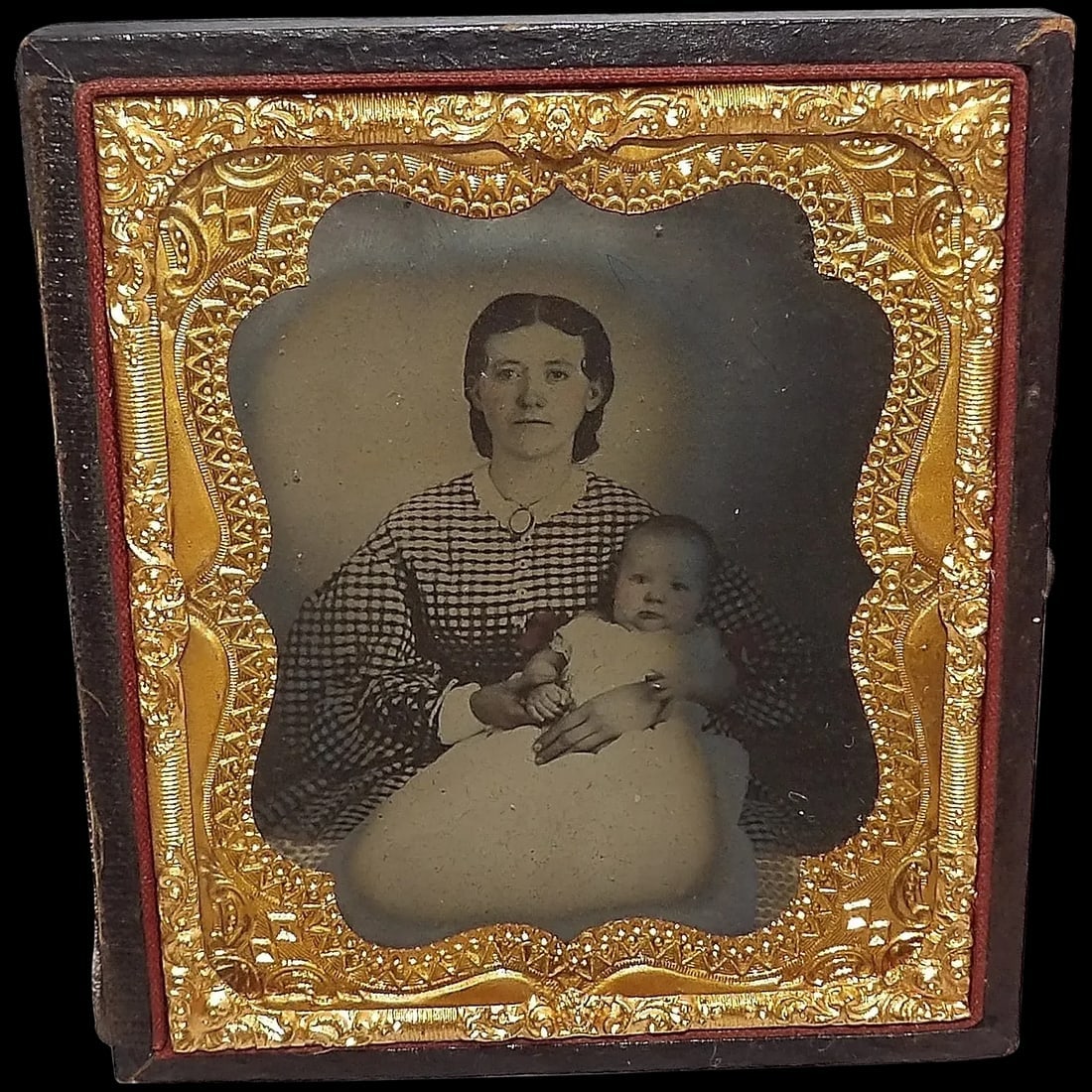 Antique Ambrotype Photo with Gold Gilt Metal and Hand Tooled Leather Frame: This Antique Ambrotype Photo with Gold Gilt Metal and Hand Tooled Leather Frame is in great condition. There is a note behind the picture stating when it was taken – 1866. Frames that are missin